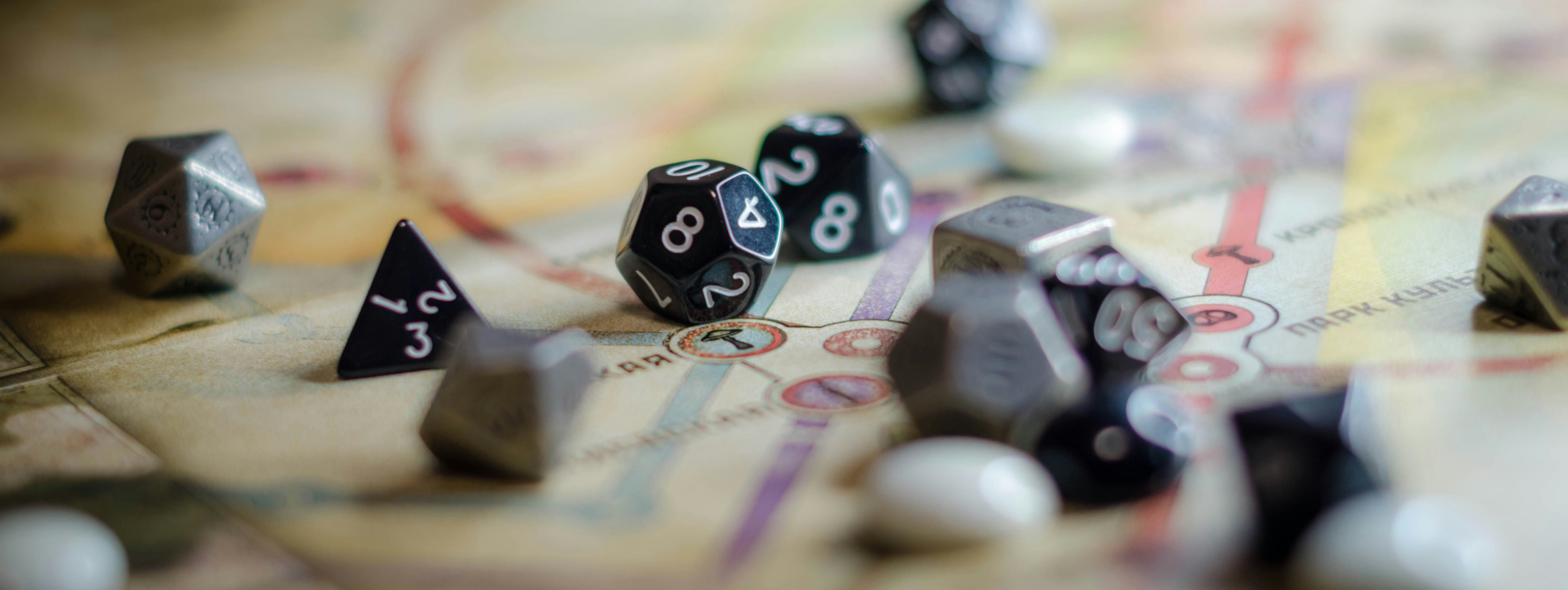 black and white dice on a brown wooden table